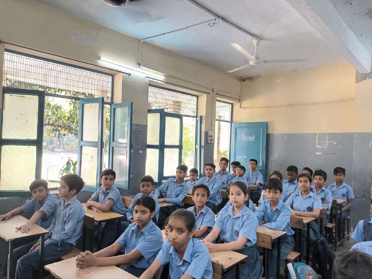 Students learning in the school classroom