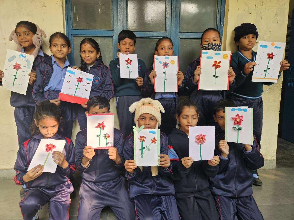 Students displaying their flower crafts
